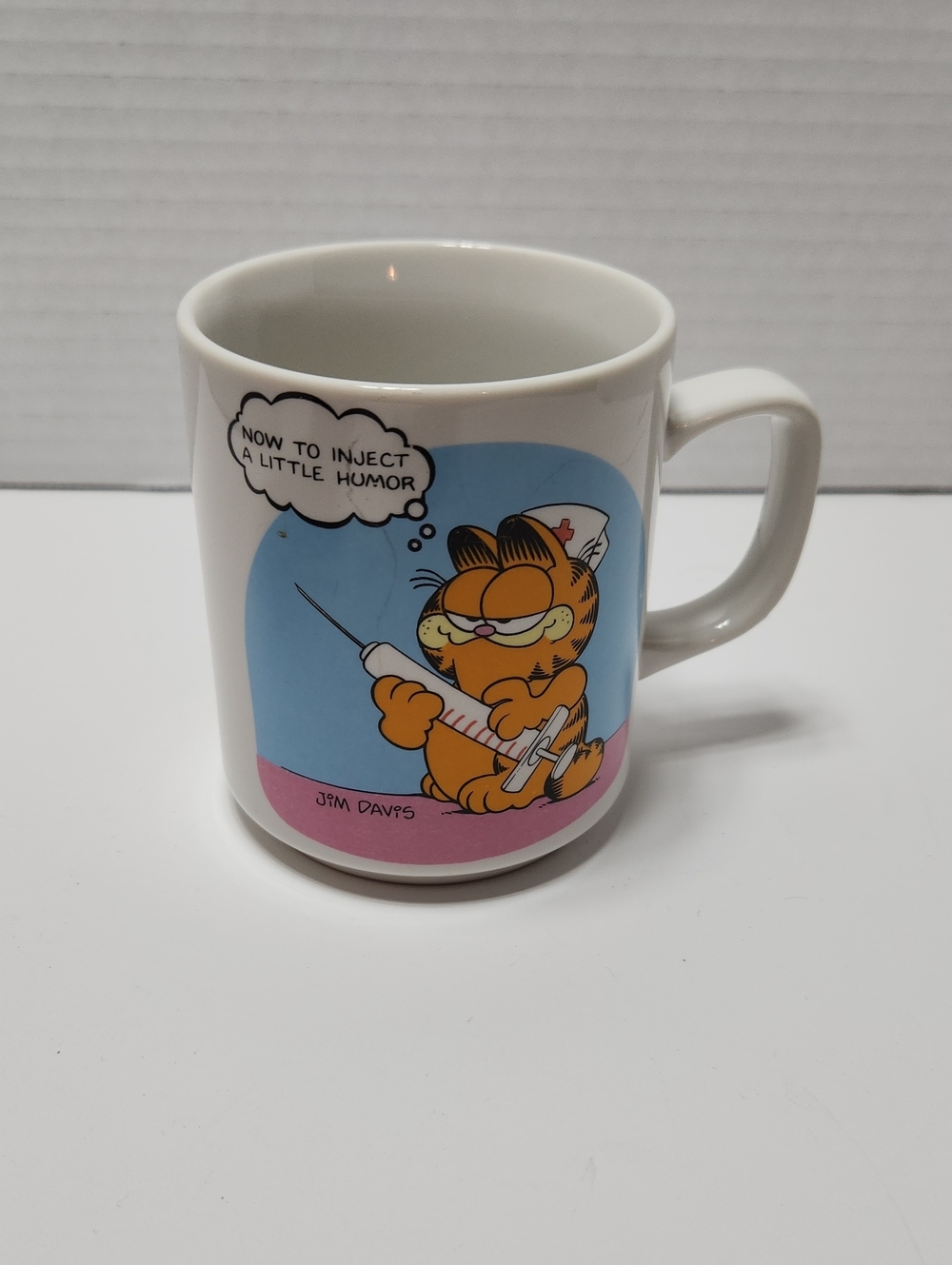 Vintage Garfield Ceramic Mug with Fun Nurse Illustration